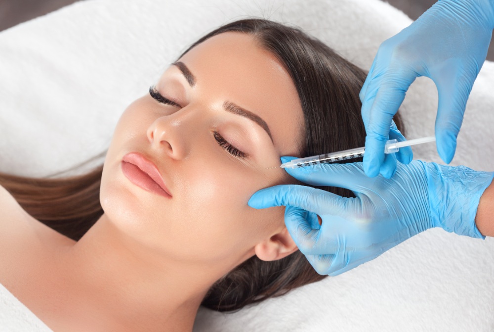 Facial injection procedure in progress
